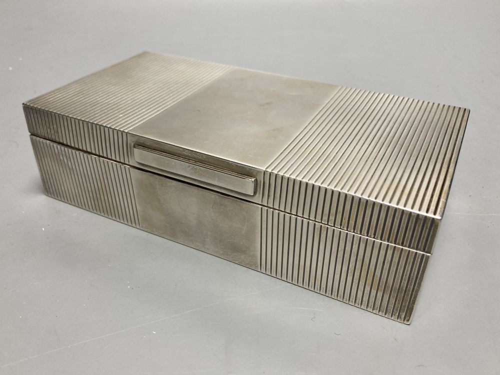 A George VI ribbed silver mounted rectangular cigarette box, Mappin & Webb, London, 1946, 17.8cm.